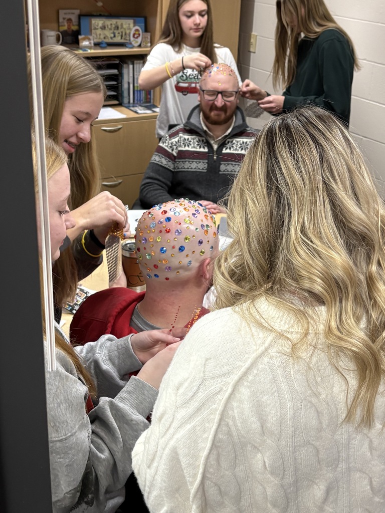 Talk about being good sports! 😄✨  At EMS, we celebrated WinterFest today before kicking off our holiday break, and one group of 8th grade girls had a very creative way to spread some school spirit. They earned the chance to bedazzle Principal Morrison, band director Mr. Morley, and our new PE teacher Mr. Campbell.  Thanks to these three for being such great sports and helping make WinterFest a memorable way to wrap up the semester! 💜❄️