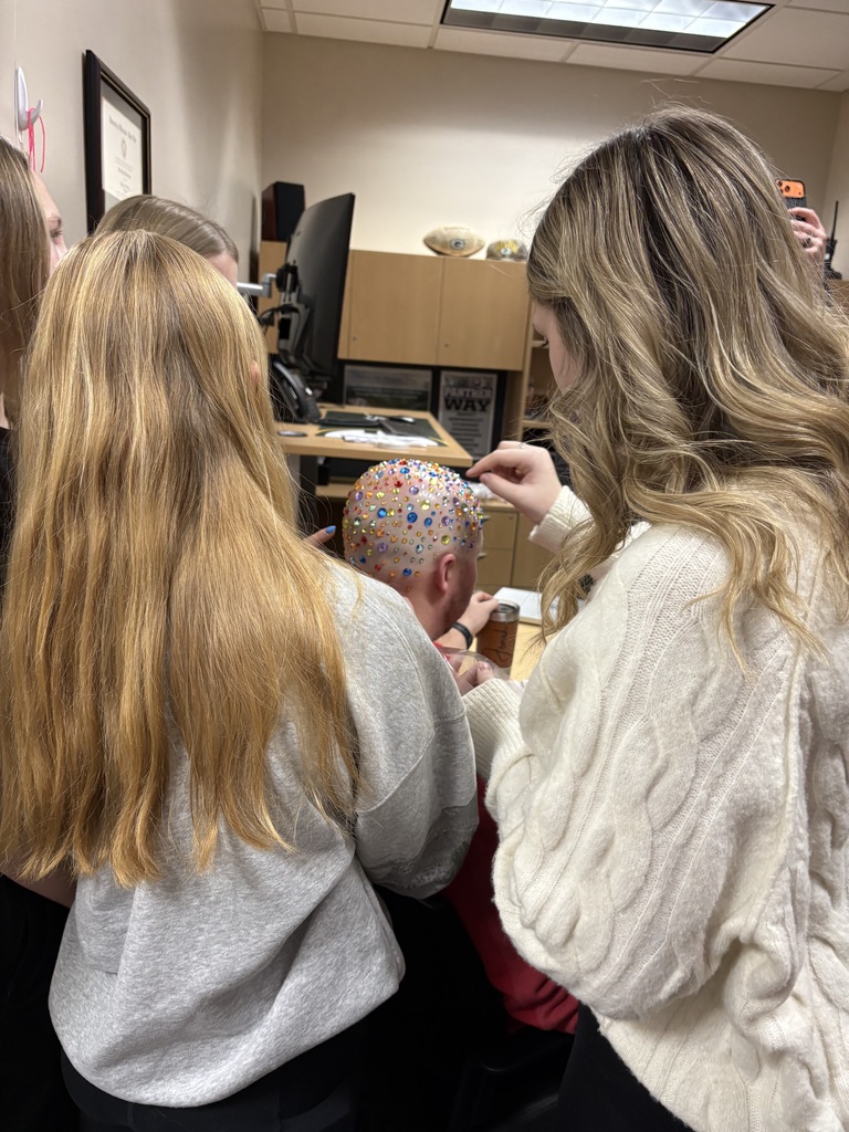Talk about being good sports! 😄✨  At EMS, we celebrated WinterFest today before kicking off our holiday break, and one group of 8th grade girls had a very creative way to spread some school spirit. They earned the chance to bedazzle Principal Morrison, band director Mr. Morley, and our new PE teacher Mr. Campbell.  Thanks to these three for being such great sports and helping make WinterFest a memorable way to wrap up the semester! 💜❄️