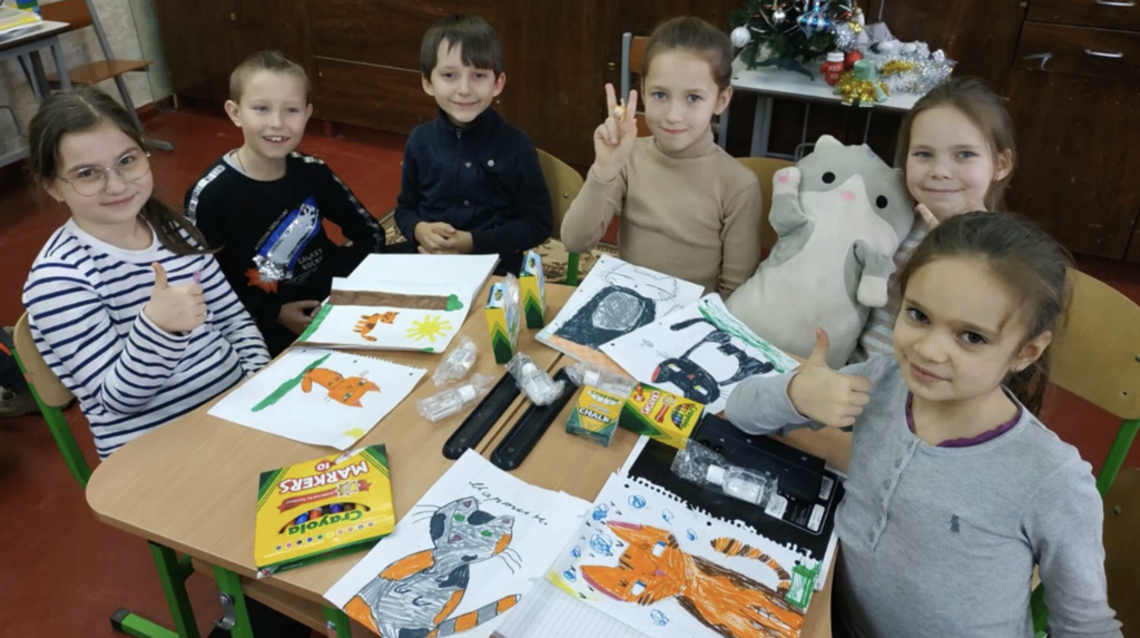 💙💛 An update we’ve been hoping to share  We received a message from the principal of Radomyshl HUB Lyceum 2 letting us know that the school supplies our students raised and shipped have arrived safely.  The principal shared that the pupils and teachers were extremely pleasantly surprised. The school supplies will be used during lessons and for creative activities. The blankets will be especially helpful when students are in shelters during air raid alerts. The torches are critical during power outages, and the calculators will be put to good use in math classes.  Most meaningful of all, they shared how much the gifts, fundraising effort, and letters of support meant to them. They said the entire shipment brought joy and a strong feeling of support, and that they were deeply touched by our students’ kindness.  We are so proud of our students for organizing this fundraiser and showing what it means to care for others, even across the world. 💜🐾