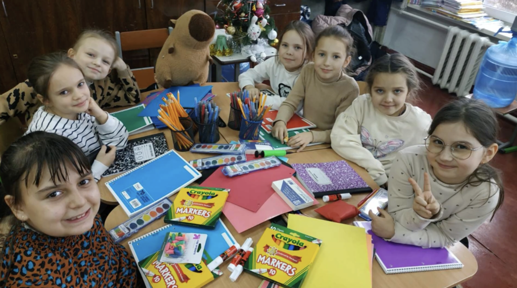 💙💛 An update we’ve been hoping to share  We received a message from the principal of Radomyshl HUB Lyceum 2 letting us know that the school supplies our students raised and shipped have arrived safely.  The principal shared that the pupils and teachers were extremely pleasantly surprised. The school supplies will be used during lessons and for creative activities. The blankets will be especially helpful when students are in shelters during air raid alerts. The torches are critical during power outages, and the calculators will be put to good use in math classes.  Most meaningful of all, they shared how much the gifts, fundraising effort, and letters of support meant to them. They said the entire shipment brought joy and a strong feeling of support, and that they were deeply touched by our students’ kindness.  We are so proud of our students for organizing this fundraiser and showing what it means to care for others, even across the world. 💜🐾