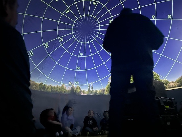 🌎✨ Out of This World Learning! ✨🌙 Our 3rd graders had an amazing visit from the traveling planetarium! Students explored the rotations of our planet, learned about the phases of the moon, and discovered star constellations lighting up the night sky. 🌟 What a fun and unforgettable way to bring science to life right here at school! 🚀💜 #PantherPride