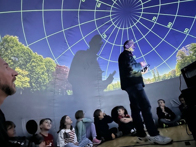 🌎✨ Out of This World Learning! ✨🌙 Our 3rd graders had an amazing visit from the traveling planetarium! Students explored the rotations of our planet, learned about the phases of the moon, and discovered star constellations lighting up the night sky. 🌟 What a fun and unforgettable way to bring science to life right here at school! 🚀💜 #PantherPride