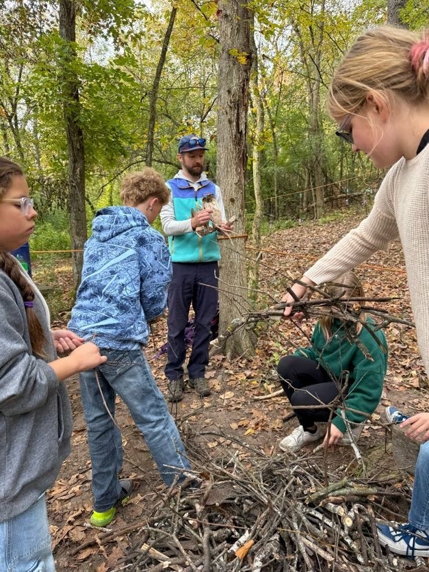 🔥🌲 Learning Outside the Classroom! 🌲🔥  Our 5th graders recently enjoyed an awesome outdoor adventure with Red Wing ELC!  Students had several activities to choose from, including outdoor cookery, fishing at the Alma Float, rock climbing, outdoor photography, and canoeing. 🎣🧗📸🛶  During outdoor cookery, students learned how to safely gather wood and start a fire with supervision. Then came the tasty part! They cooked over an open campfire, making bannock (pancakes with cornmeal), ham and cheese pudgie pies, pizza quesadillas, and banana boats. 🔥🍌  What a great opportunity for our students to get outside, try something new, learn some hands-on skills, and make memories with their classmates!  A big thank you to Red Wing ELC for providing such a fun and memorable experience for our 5th graders! 💜