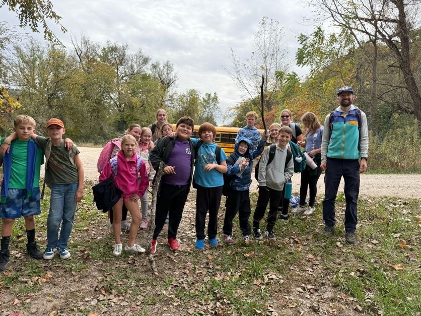 🔥🌲 Learning Outside the Classroom! 🌲🔥  Our 5th graders recently enjoyed an awesome outdoor adventure with Red Wing ELC!  Students had several activities to choose from, including outdoor cookery, fishing at the Alma Float, rock climbing, outdoor photography, and canoeing. 🎣🧗📸🛶  During outdoor cookery, students learned how to safely gather wood and start a fire with supervision. Then came the tasty part! They cooked over an open campfire, making bannock (pancakes with cornmeal), ham and cheese pudgie pies, pizza quesadillas, and banana boats. 🔥🍌  What a great opportunity for our students to get outside, try something new, learn some hands-on skills, and make memories with their classmates!  A big thank you to Red Wing ELC for providing such a fun and memorable experience for our 5th graders! 💜