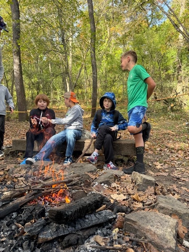 🔥🌲 Learning Outside the Classroom! 🌲🔥  Our 5th graders recently enjoyed an awesome outdoor adventure with Red Wing ELC!  Students had several activities to choose from, including outdoor cookery, fishing at the Alma Float, rock climbing, outdoor photography, and canoeing. 🎣🧗📸🛶  During outdoor cookery, students learned how to safely gather wood and start a fire with supervision. Then came the tasty part! They cooked over an open campfire, making bannock (pancakes with cornmeal), ham and cheese pudgie pies, pizza quesadillas, and banana boats. 🔥🍌  What a great opportunity for our students to get outside, try something new, learn some hands-on skills, and make memories with their classmates!  A big thank you to Red Wing ELC for providing such a fun and memorable experience for our 5th graders! 💜