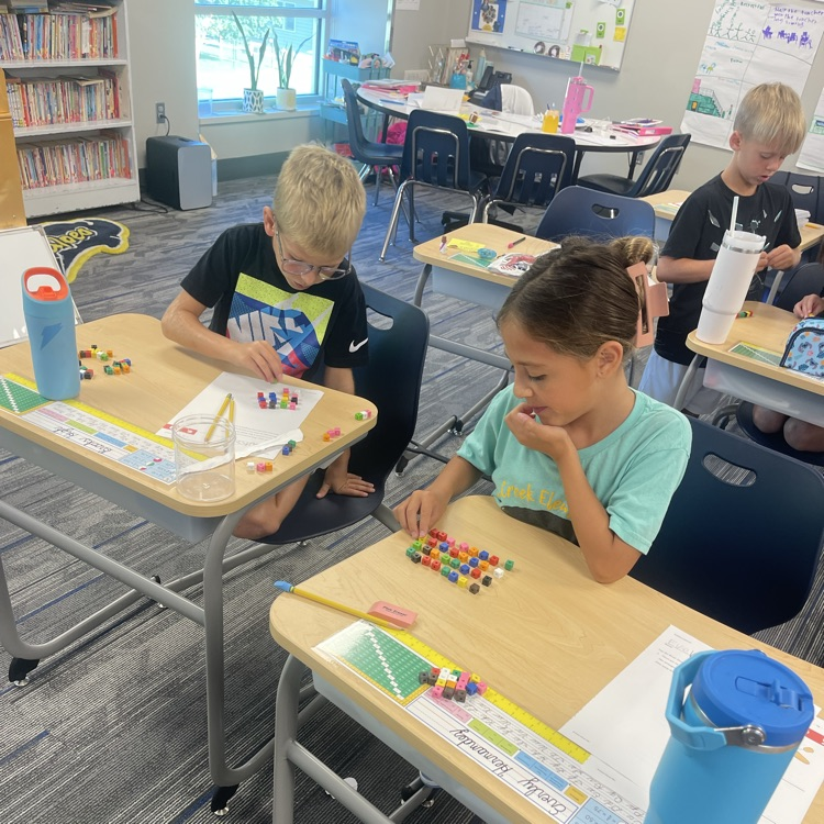 third graders practicing division
