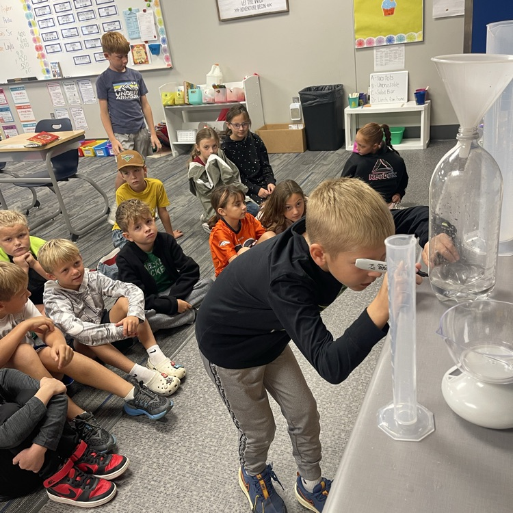 third grader measuring