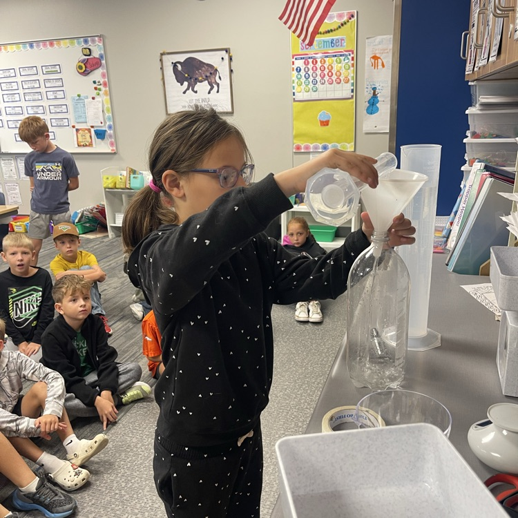 third grader measuring