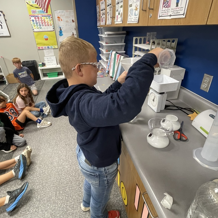 third grader measuring
