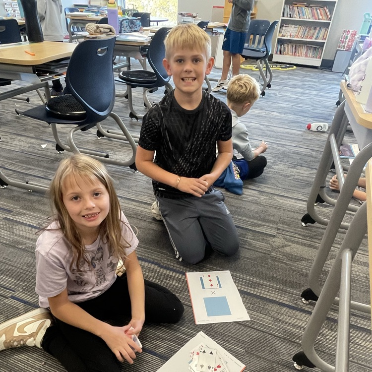 3rd graders playing a math game