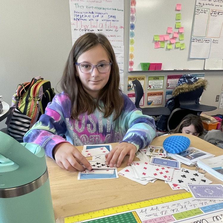 3rd grader playing a math game