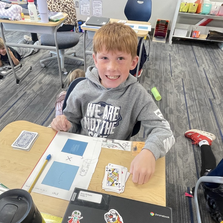 3rd grader playing a math game