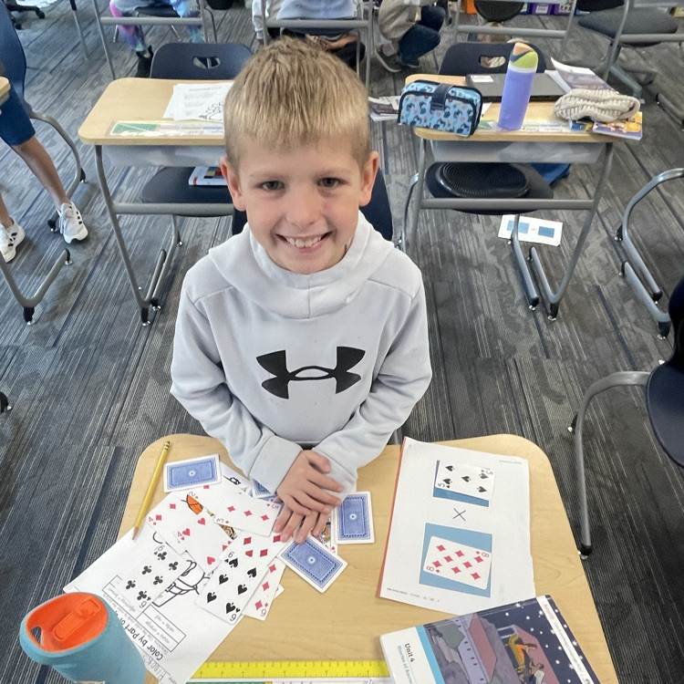 3rd grader playing a math game