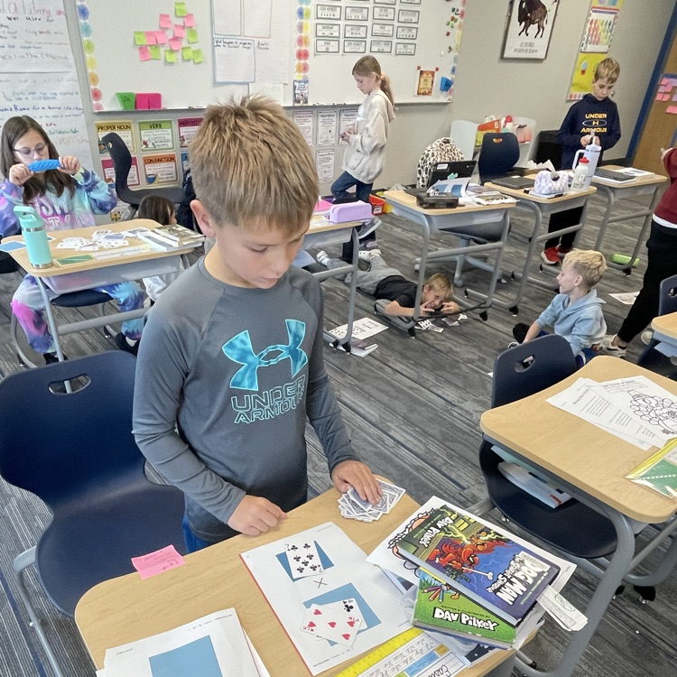3rd graders playing a math game