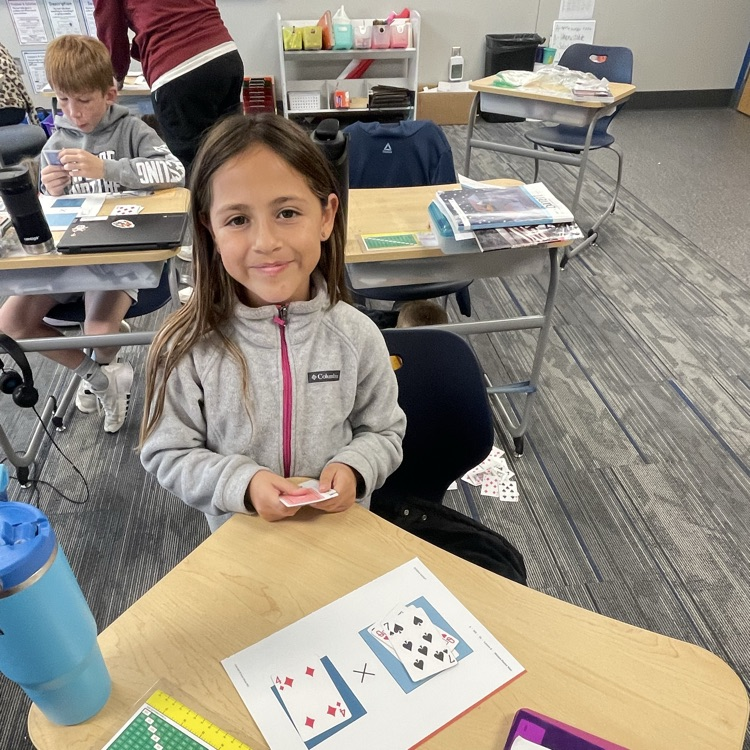 3rd grader playing a math game
