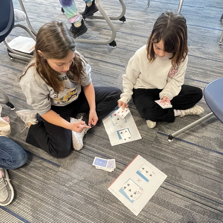 3rd graders playing a math game