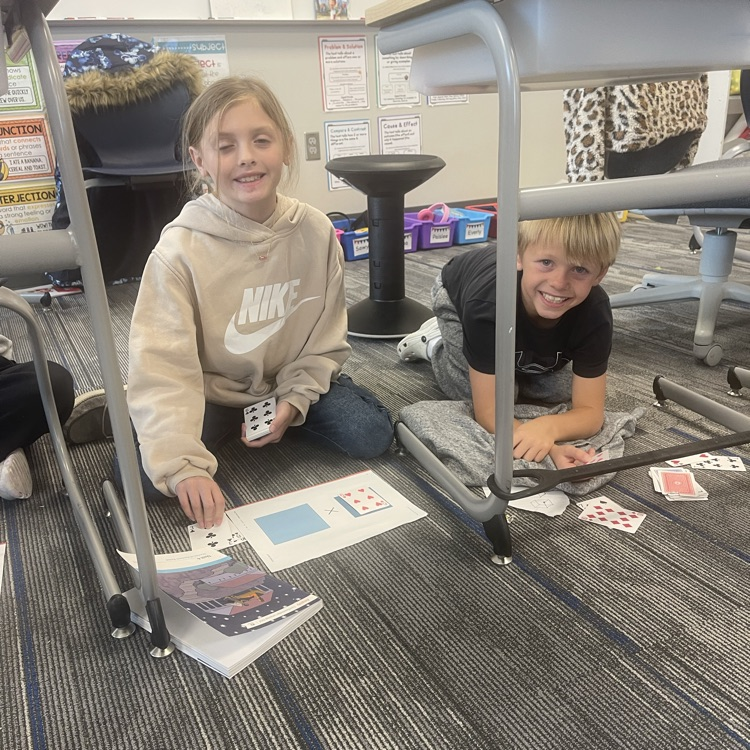 3rd graders playing a math game