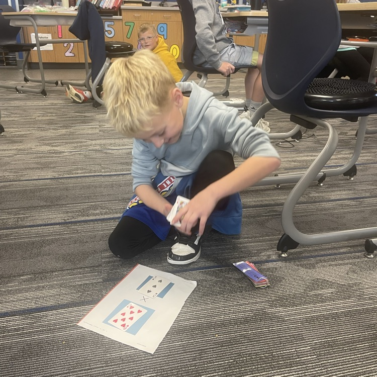 3rd graders playing a math game