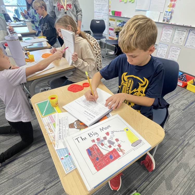third graders making butterfly fossils