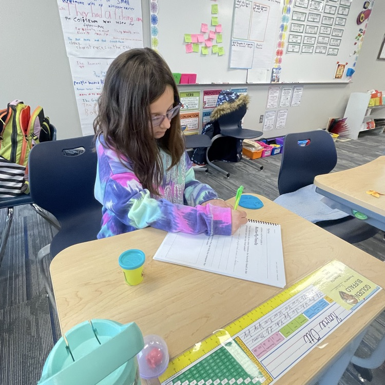 third graders making butterfly fossils