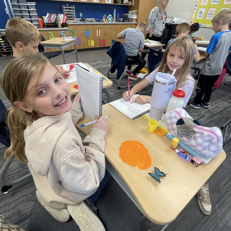 third graders making butterfly fossils