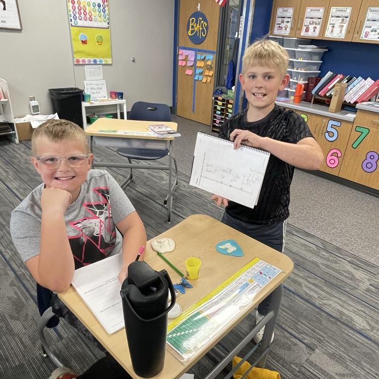 third graders making butterfly fossils