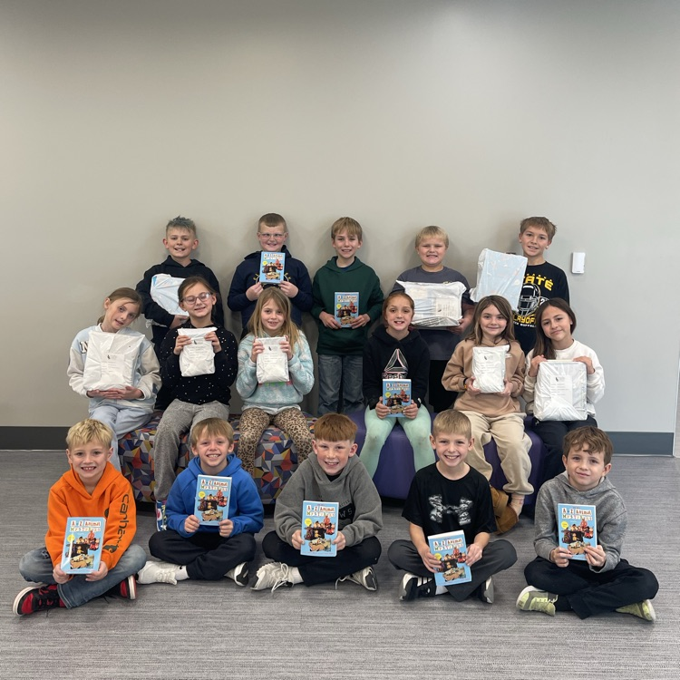 third graders with books