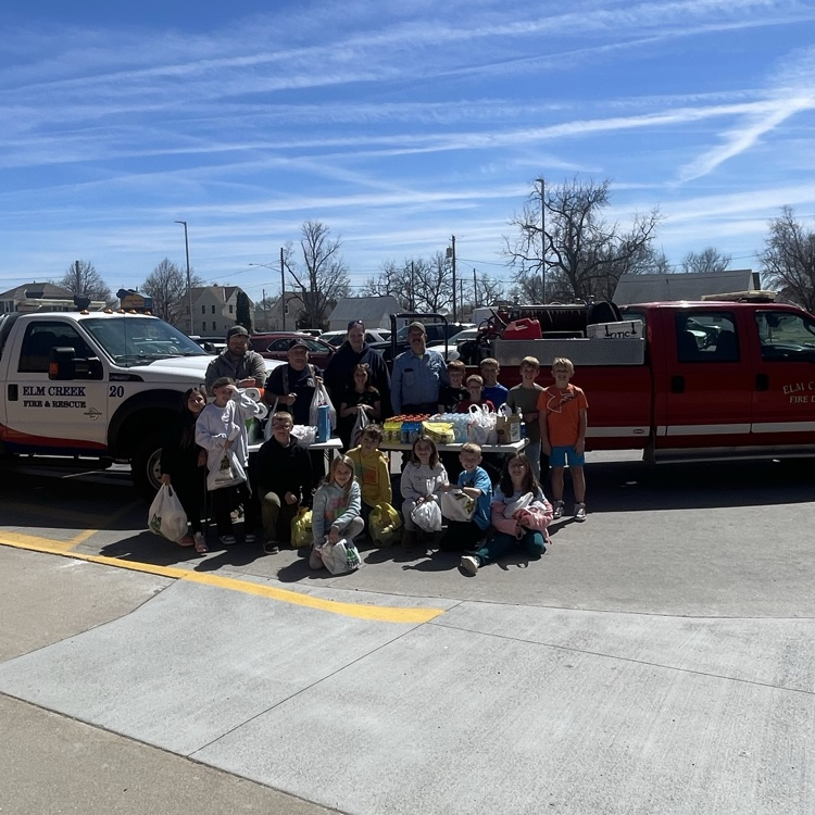 firefighters and elementary students 