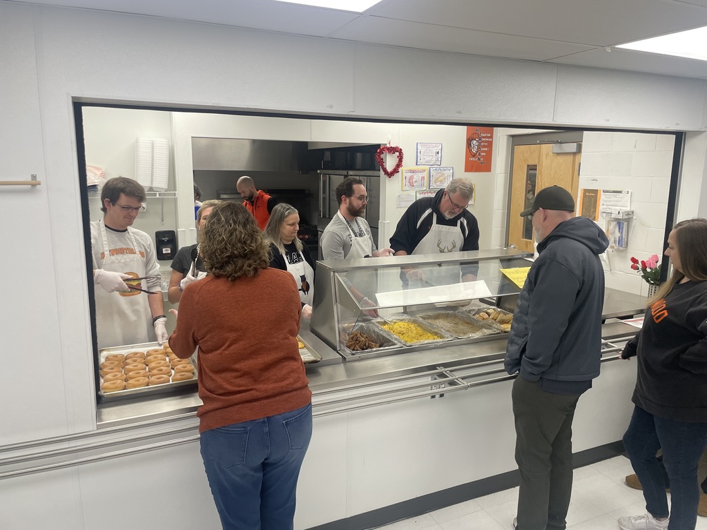 Elmwood Staff Members serving breakfast for parents and students this morning.