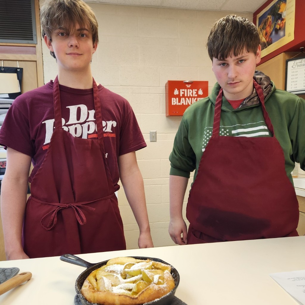 Boys made German baked pancake with apple filling.