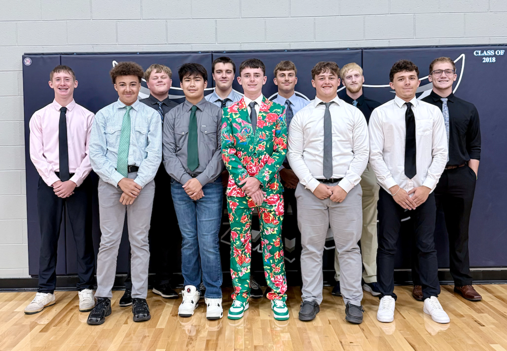 11 HS football players dressed up for game day