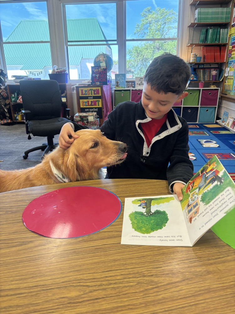 Mateo reading to Chloe.