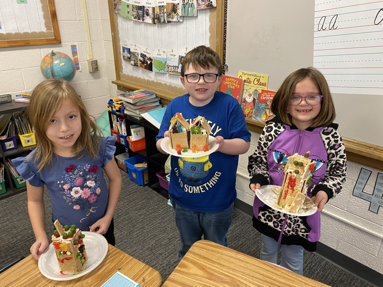 2nd grade students with gingerbread houses