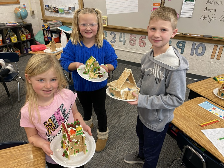 2nd grade students with gingerbread houses