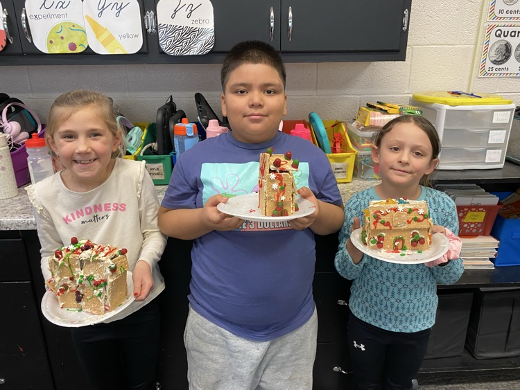 2nd grade students with gingerbread houses