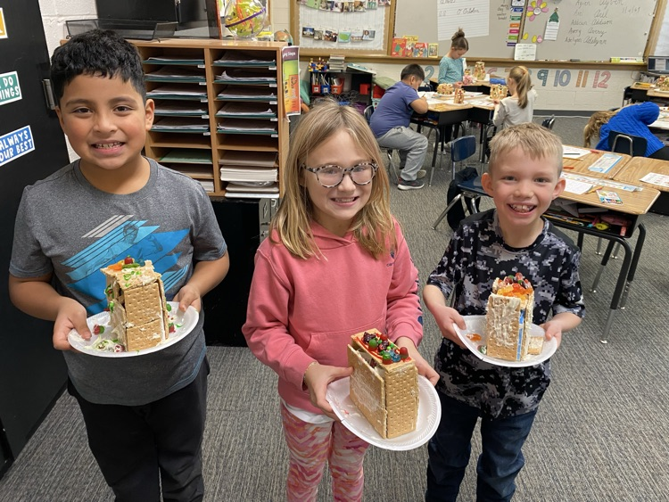 2nd grade students with gingerbread houses
