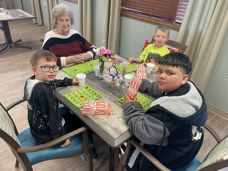 2nd graders playing Bingo with residents 