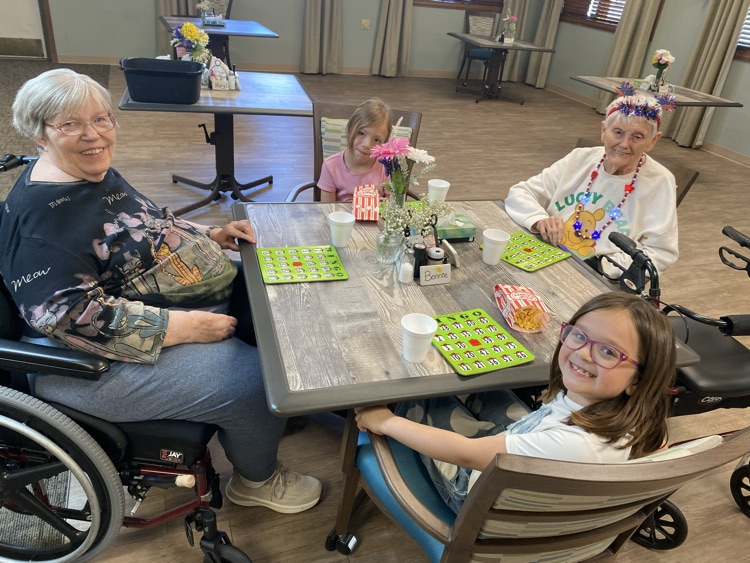 2nd graders playing Bingo with residents