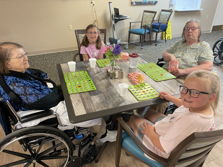 2nd graders playing Bingo with residents