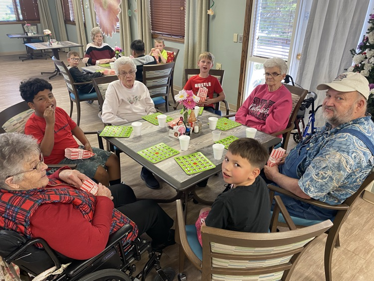 2nd graders playing Bingo with residents