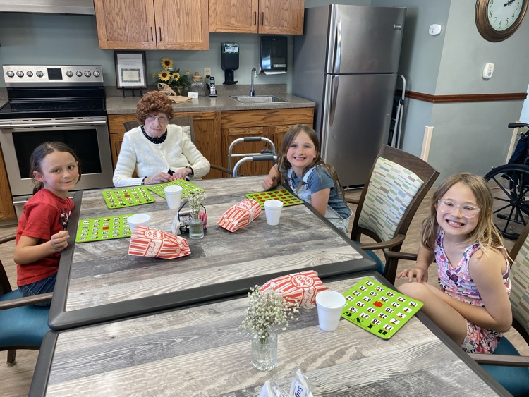 2nd graders playing Bingo with residents