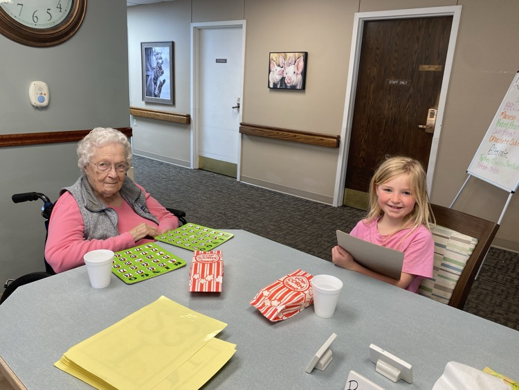 2nd graders playing Bingo with residents