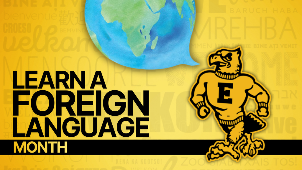 Graphic promoting "Learn a Foreign Language Month" with a muscular eagle mascot wearing an "E" sweater, a globe in a speech bubble, and multilingual "welcome" text in the background.