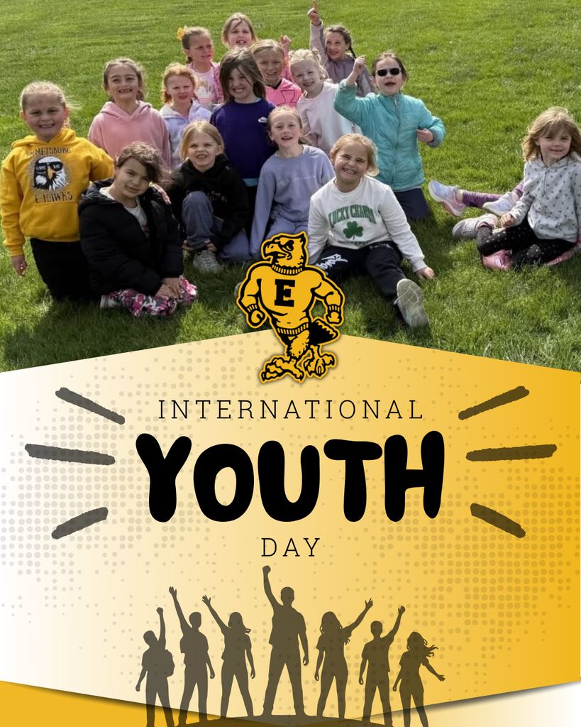 Emmetsburg Community School District celebrates International Youth Day with a joyful group of elementary students gathered outdoors.