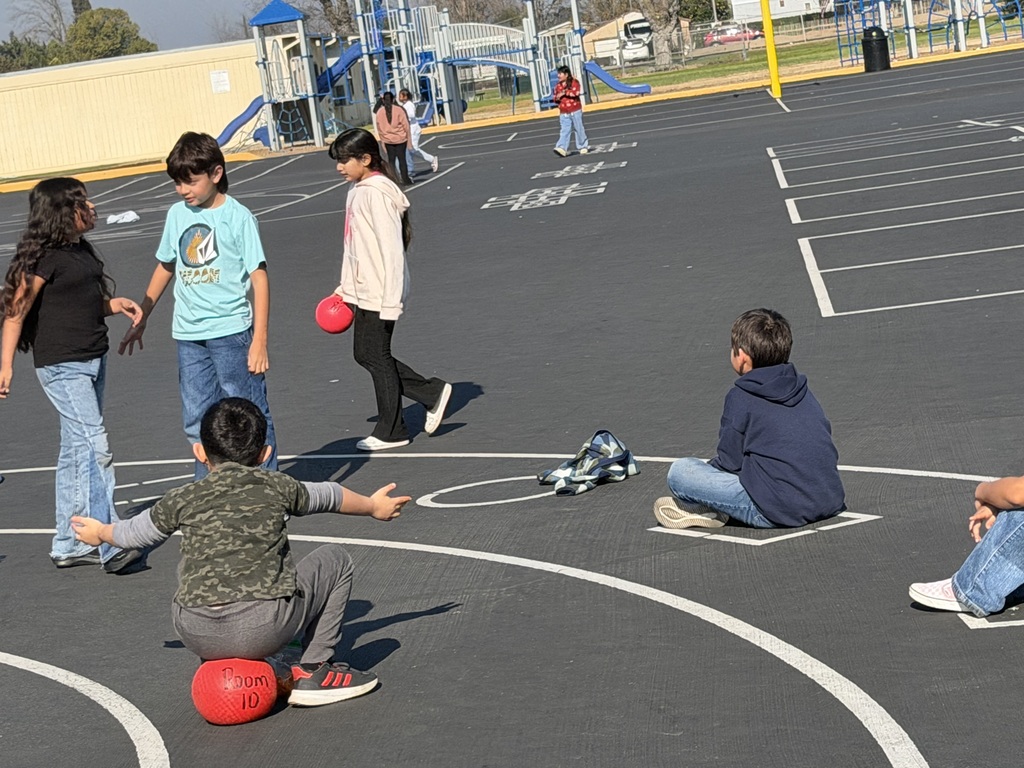 3rd grade students enjoying playground equipment