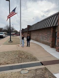 Leadership students hanging the flag 