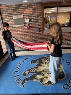 Leadership students hanging the flag 