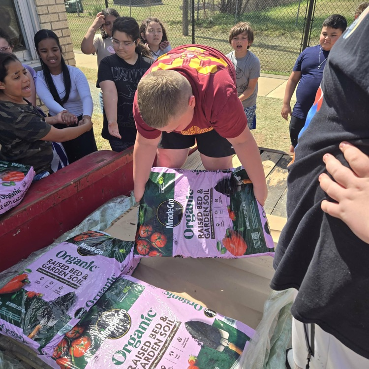 Thanks to our fourth and fifth graders for getting soil bags ready for our school garden.