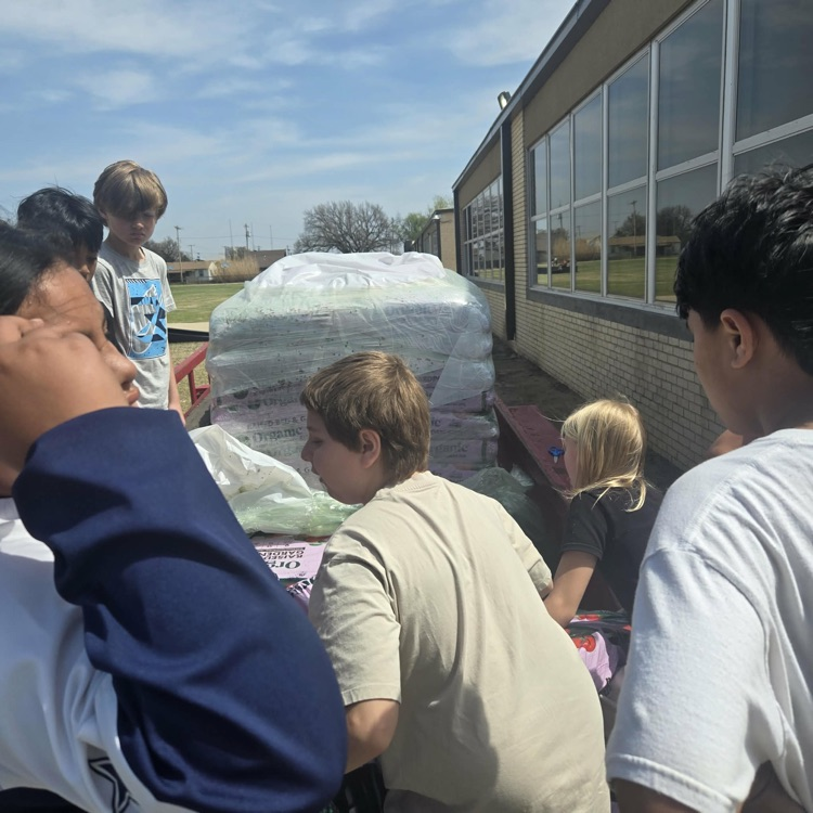 Thanks to our fourth and fifth graders for getting soil bags ready for our school garden.