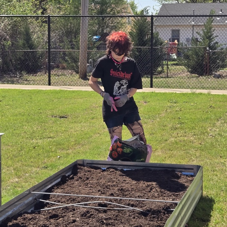 The Monroe Garden Club preps our new garden boxes.💙🦁💛